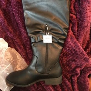 New with tags black calf boots.